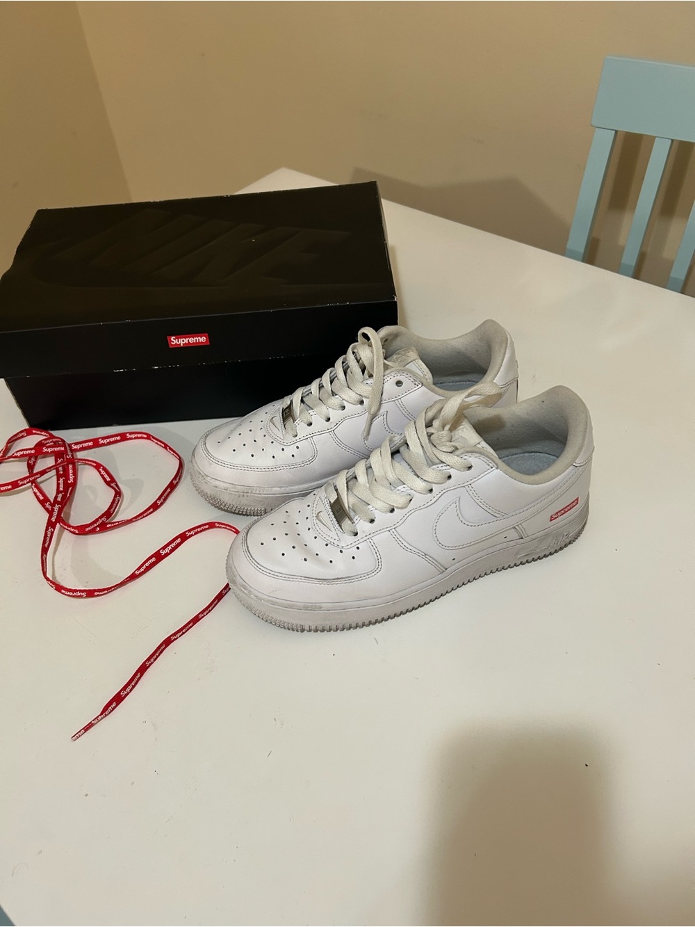 Nike Supreme White Low-Top Sneakers with Subtle Red Detail